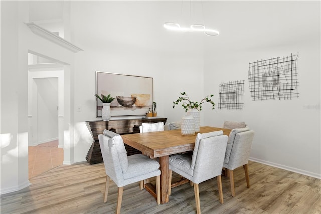 8701 Ballantrae Way, Tampa, FL 33647 - dining room featuring light hardwood / wood-style floors and a high ceiling