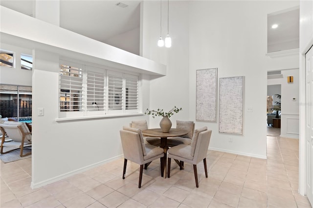 8701 Ballantrae Way, Tampa, FL 33647 - dining area with light tile patterned floors and a high ceiling