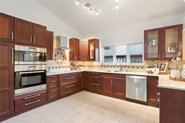 8701 Ballantrae Way, Tampa, FL 33647 - kitchen featuring stainless steel appliances, sink, backsplash, and wall chimney exhaust hood