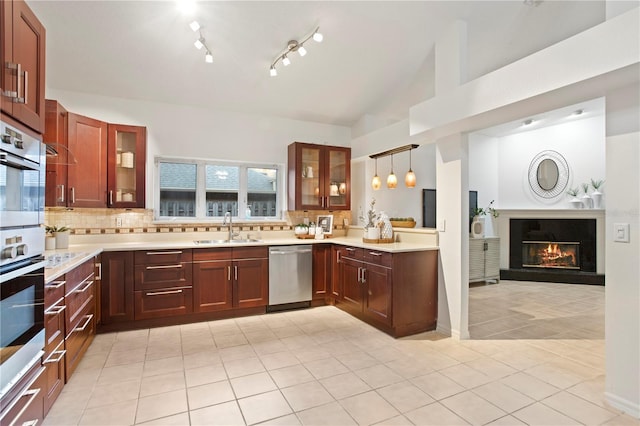 8701 Ballantrae Way, Tampa, FL 33647 - kitchen with light tile patterned flooring, sink, decorative light fixtures, stainless steel appliances, and decorative backsplash