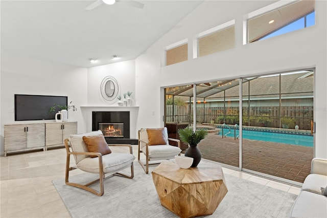8701 Ballantrae Way, Tampa, FL 33647 - tiled living room featuring ceiling fan, high vaulted ceiling, and a healthy amount of sunlight