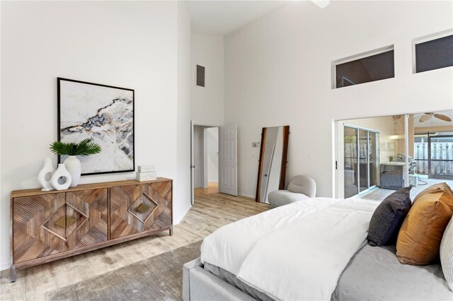 8701 Ballantrae Way, Tampa, FL 33647 - bedroom featuring hardwood / wood-style flooring, high vaulted ceiling, and access to outside