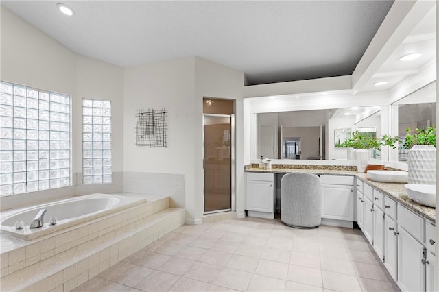 8701 Ballantrae Way, Tampa, FL 33647 - bathroom with tile patterned floors, vanity, shower with separate bathtub, and a textured ceiling