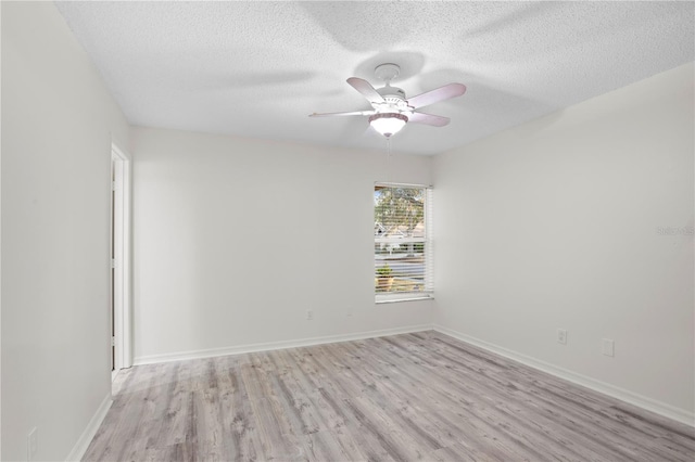 8701 Ballantrae Way, Tampa, FL 33647 - unfurnished room featuring a textured ceiling, light hardwood / wood-style floors, and ceiling fan