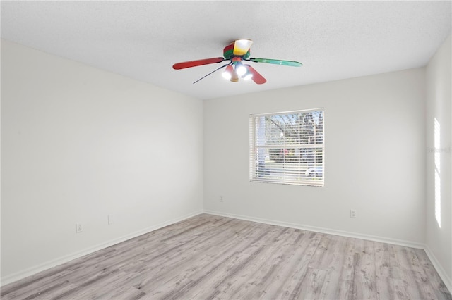 8701 Ballantrae Way, Tampa, FL 33647 - empty room with a textured ceiling, light hardwood / wood-style flooring, and ceiling fan