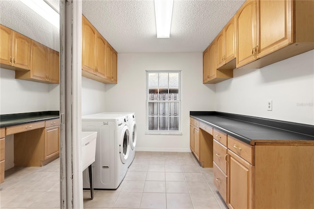 8701 Ballantrae Way, Tampa, FL 33647 - laundry area with light tile patterned floors, washing machine and dryer, cabinets, and a textured ceiling