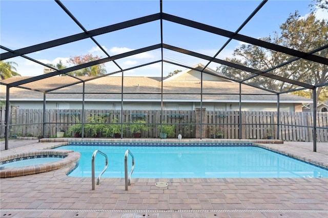 8701 Ballantrae Way, Tampa, FL 33647 - view of swimming pool featuring an in ground hot tub, glass enclosure, and a patio area