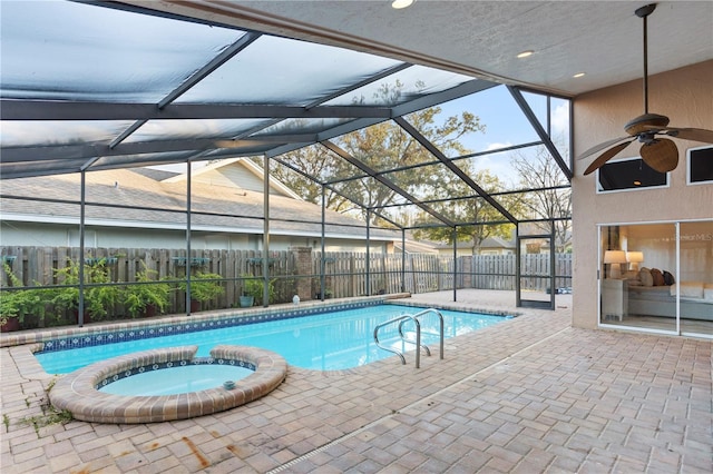 8701 Ballantrae Way, Tampa, FL 33647 - view of pool featuring an in ground hot tub, ceiling fan, a patio, and glass enclosure