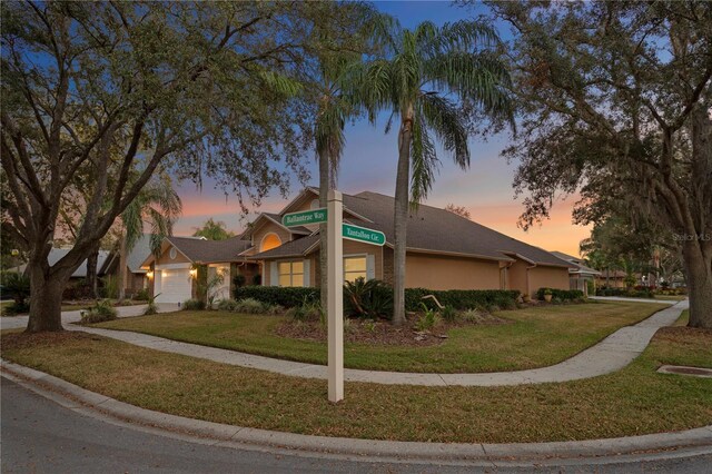 8701 Ballantrae Way, Tampa, FL 33647 - view of front of house featuring a garage and a lawn