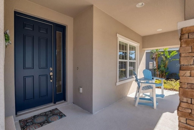 doorway to property with covered porch