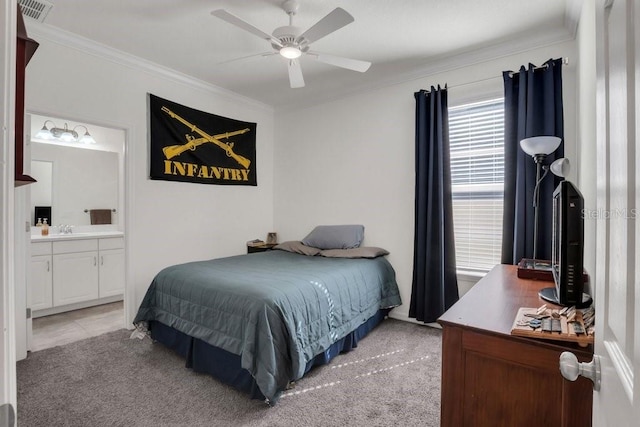 bedroom with a ceiling fan, visible vents, ornamental molding, light carpet, and connected bathroom