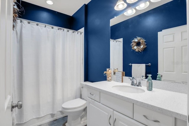 bathroom featuring tile patterned floors, vanity, and toilet