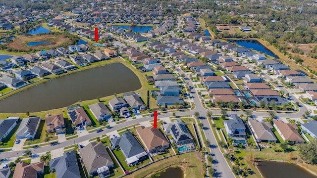 birds eye view of property featuring a water view