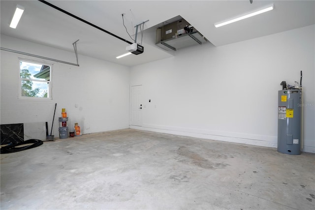 garage featuring electric water heater and a garage door opener