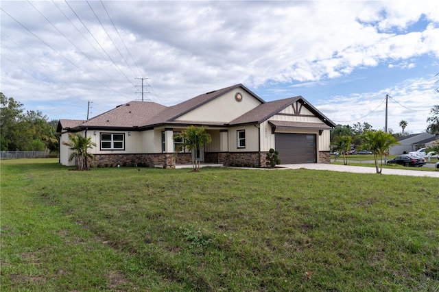 view of front of home with driveway, a front lawn, an attached garage, and stone siding