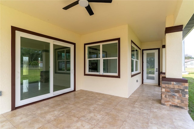 view of patio featuring ceiling fan