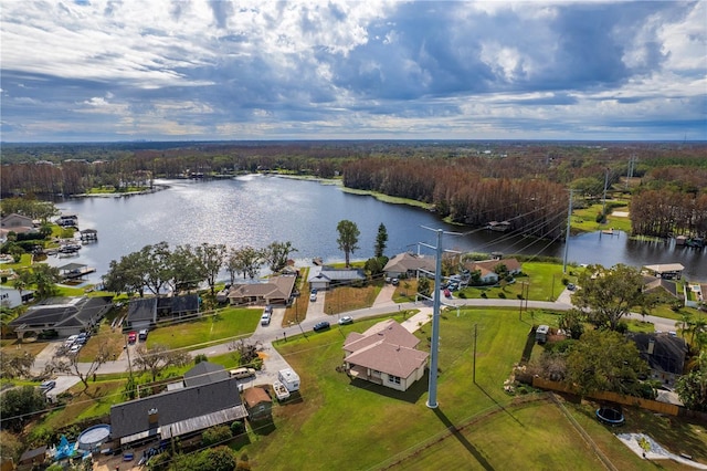 aerial view featuring a water view, a forest view, and a residential view