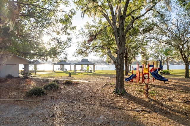 view of jungle gym with a gazebo and a water view