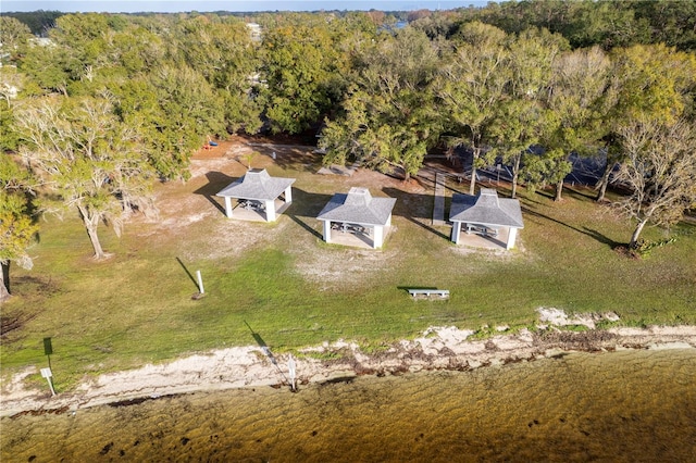 drone / aerial view with a wooded view