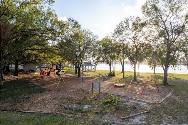 view of yard featuring a playground and a water view