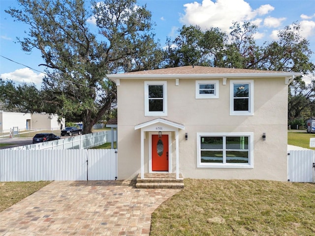 view of front of home with a front lawn