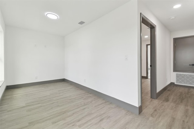 spare room with light hardwood / wood-style flooring