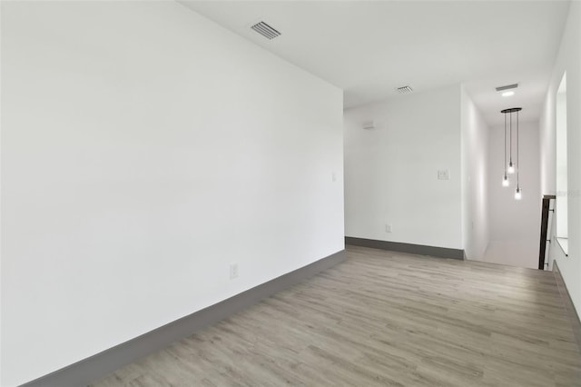 spare room featuring hardwood / wood-style flooring