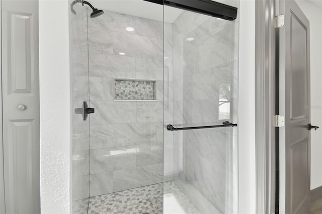 bathroom featuring an enclosed shower