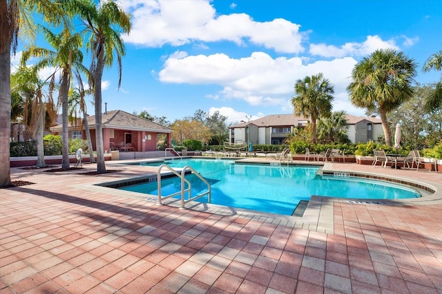 view of swimming pool featuring a patio