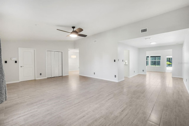 unfurnished living room with ceiling fan and light hardwood / wood-style flooring