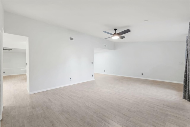 spare room with light hardwood / wood-style floors and ceiling fan