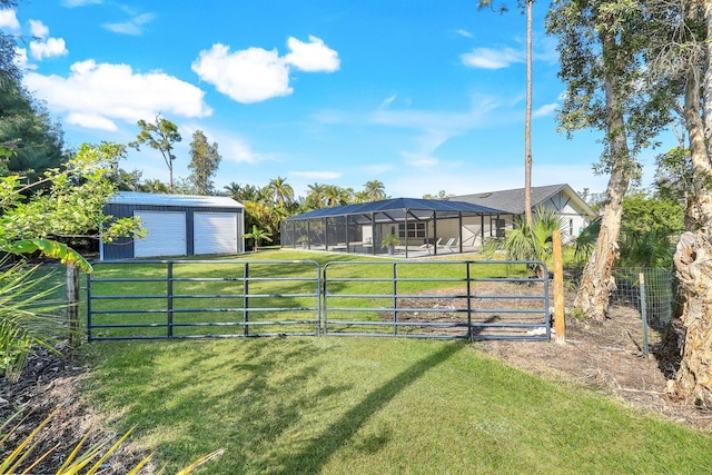 view of yard with glass enclosure and an outbuilding