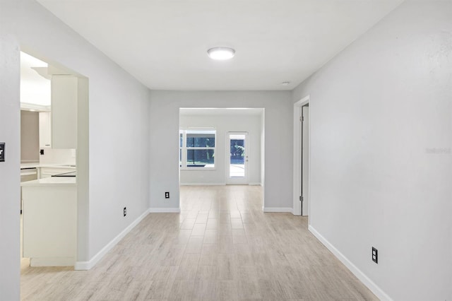 corridor featuring light hardwood / wood-style flooring