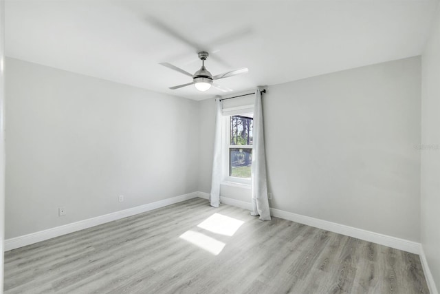 empty room with light hardwood / wood-style floors and ceiling fan