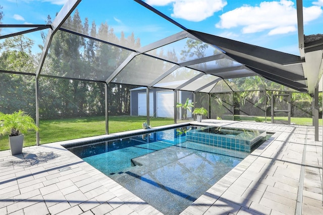 view of swimming pool with an in ground hot tub, a patio, a lanai, and a lawn