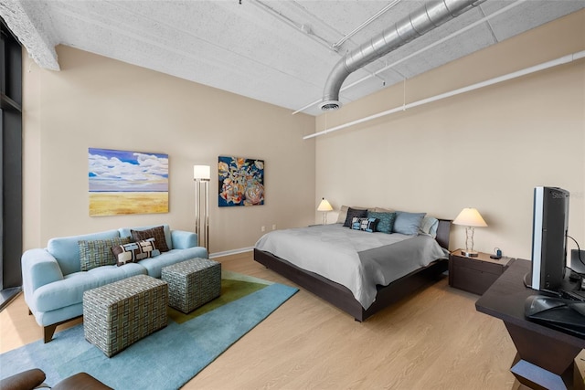 bedroom featuring hardwood / wood-style flooring