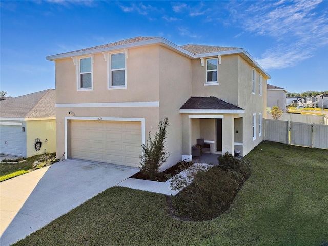 view of front of house with a garage and a front lawn