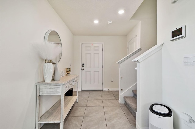 entryway with light tile patterned floors