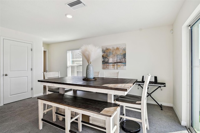 dining area featuring carpet floors