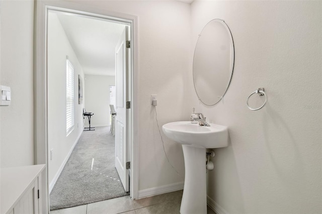 bathroom featuring sink and tile patterned flooring