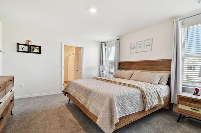 carpeted bedroom featuring multiple windows