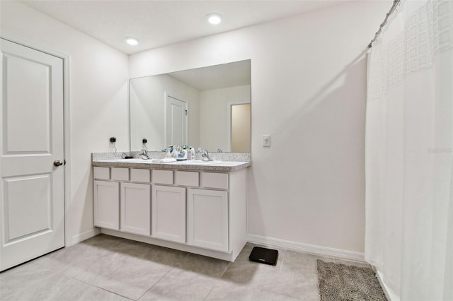 bathroom featuring vanity and tile patterned flooring