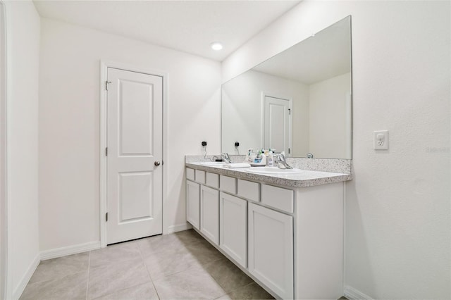 bathroom featuring vanity and tile patterned flooring