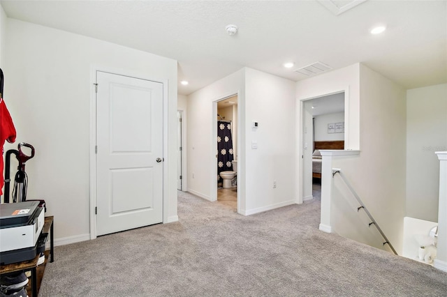 interior space featuring light colored carpet