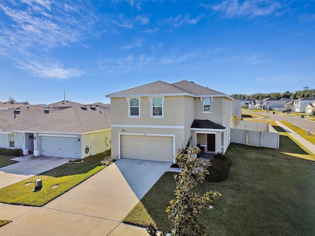 view of front of property with a garage and a front lawn