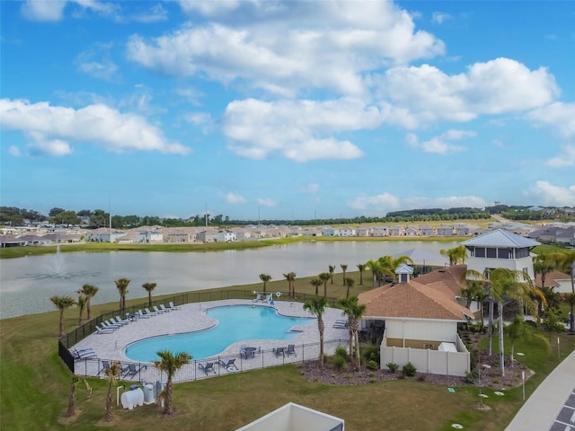 view of swimming pool featuring a patio area and a water view