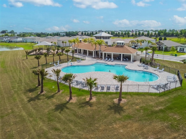 view of swimming pool with a yard, a gazebo, a patio area, and a water view