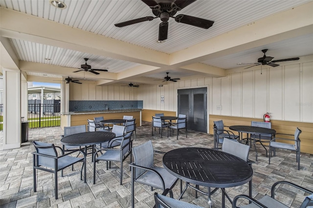 view of patio featuring french doors and ceiling fan