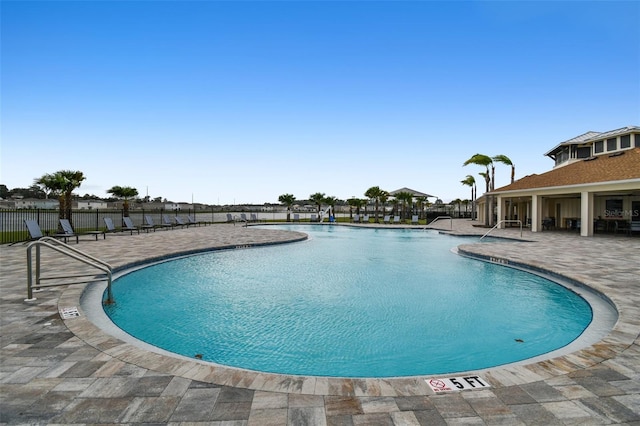 view of swimming pool with a patio area