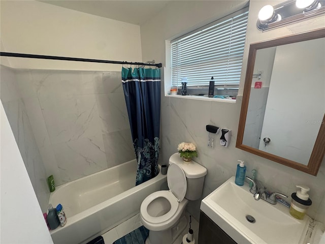 full bathroom with tile patterned floors, vanity, shower / bathtub combination with curtain, tile walls, and toilet